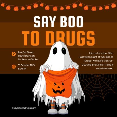 “Brown-and-orange Halloween flyer titled ‘Say Boo to Drugs’ featuring a ghost holding a pumpkin candy bag, event location East 1st Street Conference Center on October 31 at 6 p.m., and family-friendly trick-or-treat info.”