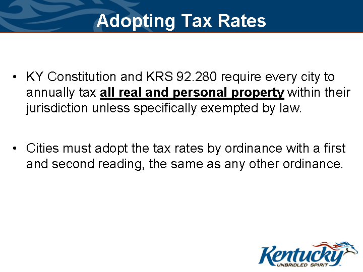 “Slide titled ‘Adopting Tax Rates’ stating Kentucky law requires cities to tax all real and personal property annually unless exempt, and to adopt rates by ordinance with first and second readings.”